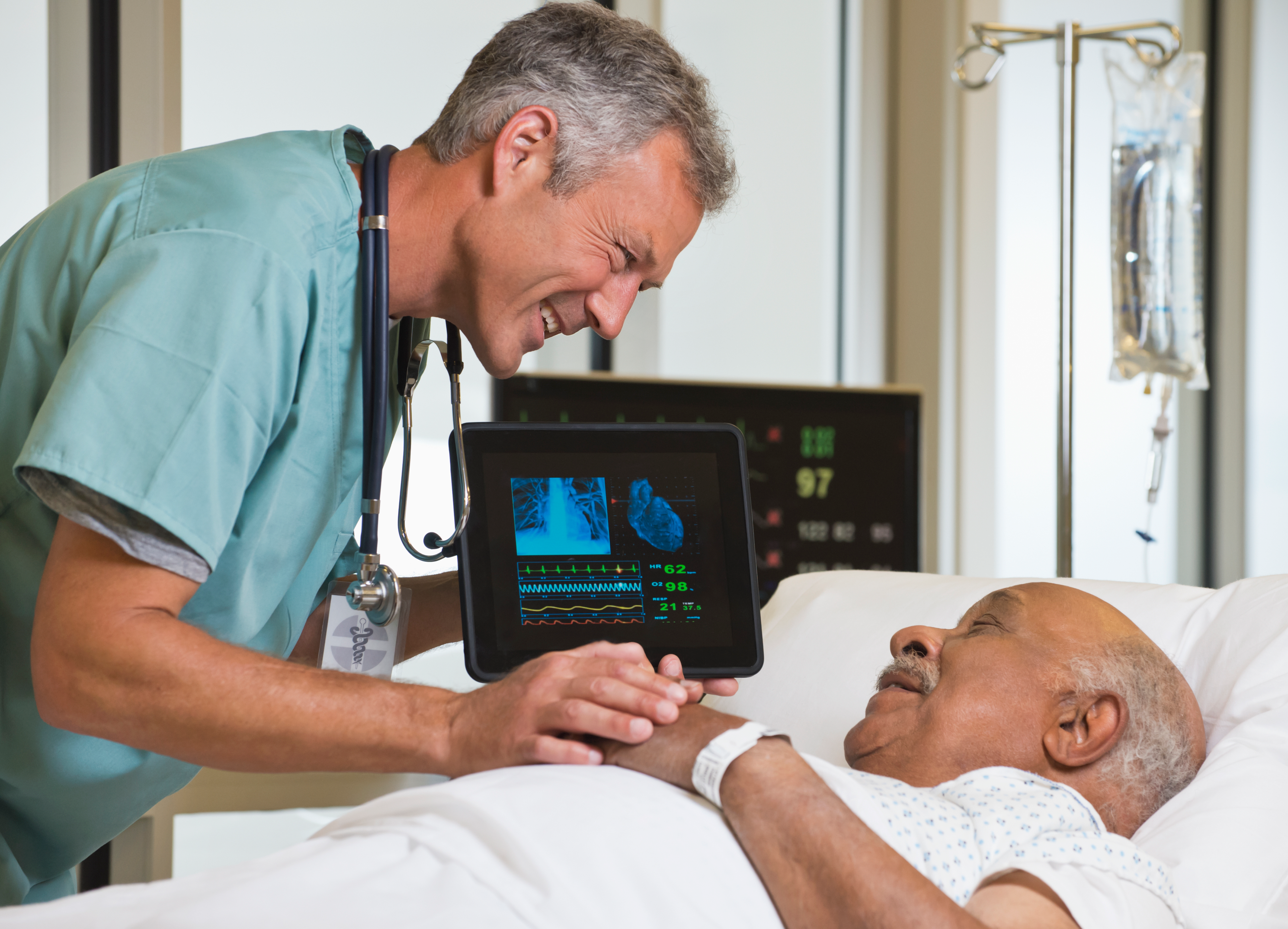 Doctor with patient and patient monitor